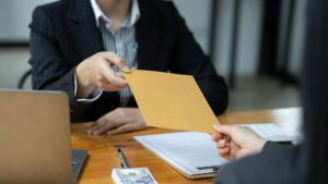 Businessman submitting legal documents litigation. Concept Financial Services Litigation